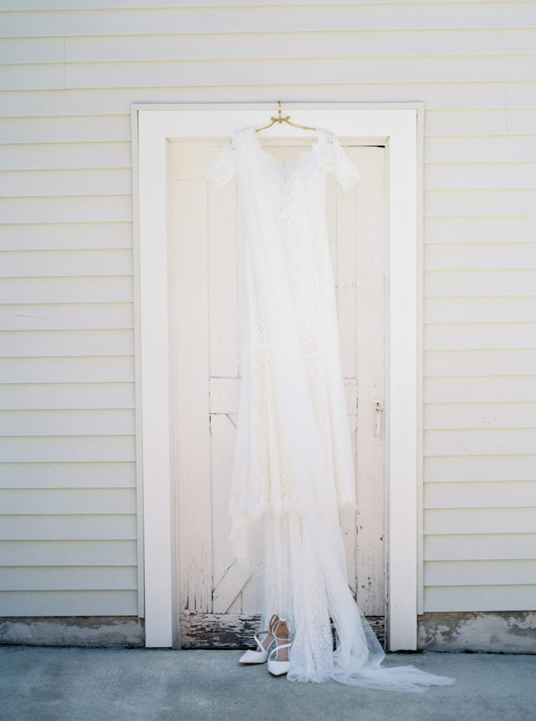 wedding gown and wedding veil on antique hanger and white pumps, fine art photography, fine art photographer, Pennsylvania wedding, film photography