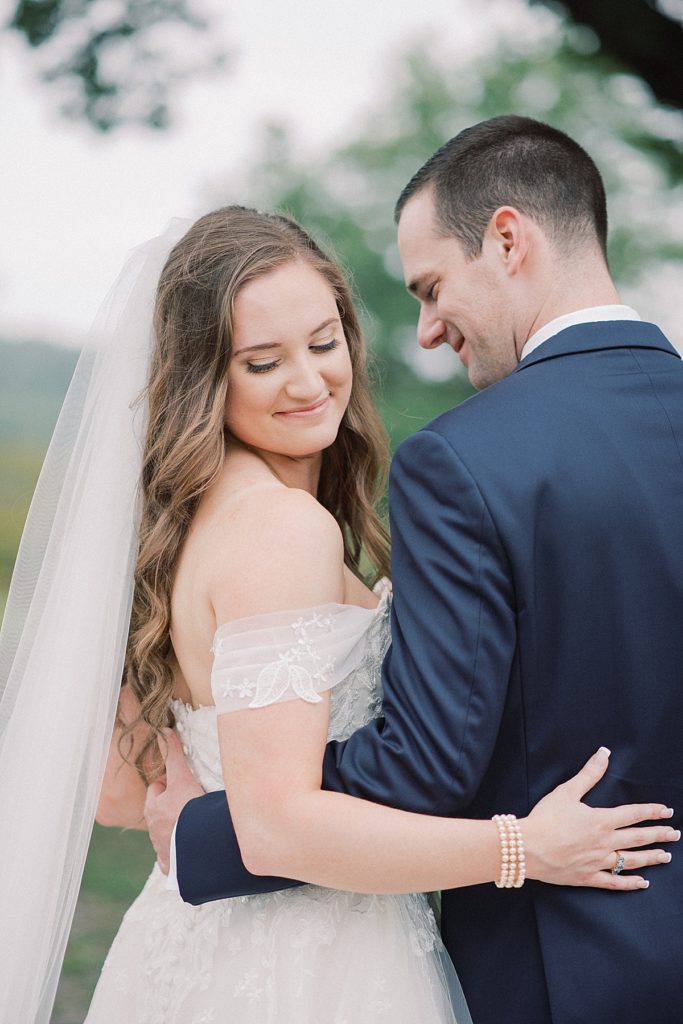 An elegant summer wedding with bride and groom at Valley Forge National Park by wedding photographers Michelle Behre Photography.