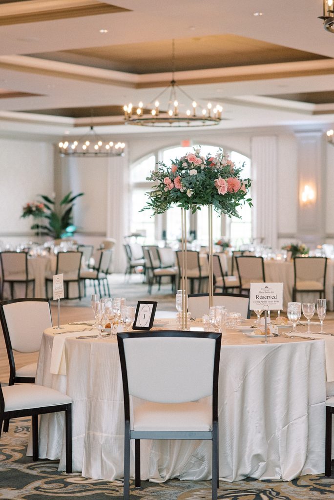 Elegant ballroom decorated with green florals and bright beautiful dahlias at the RiverCrest Country Club, Phoenixville, PA by wedding photographers Michelle Behre.
