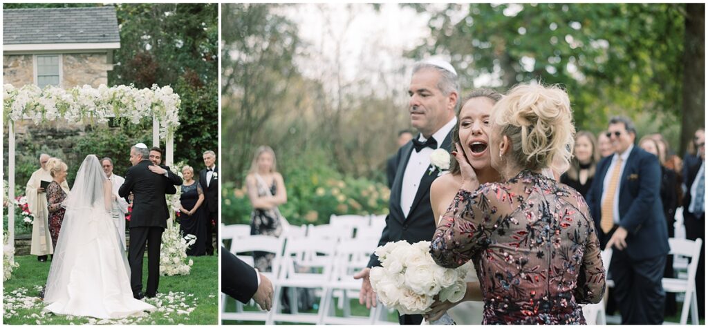 bride's parents pass her off to the groom under the chuppah in the garden at the crossed keys estate captured by michelle behre photography 